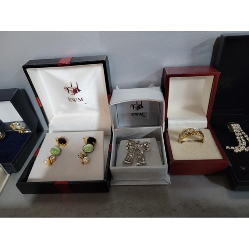 140 - Large quantity of boxed costume jewellery inc earrings, rings, faux pearl earrings etc