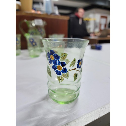 153 - Green glass hand painted lemonade set inc a large jug and 5 glasses, one glass has a small nibble to... 