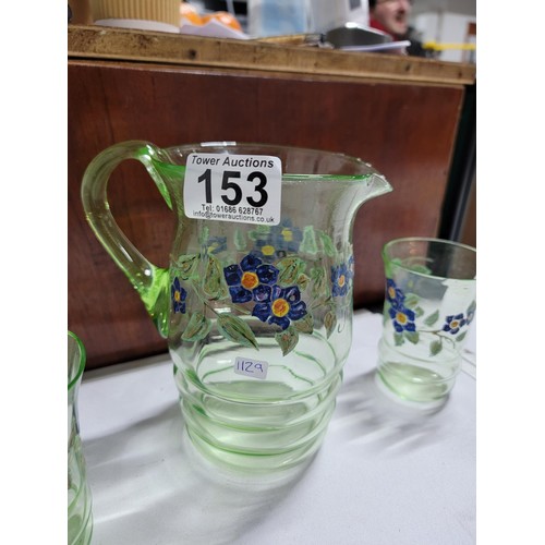 153 - Green glass hand painted lemonade set inc a large jug and 5 glasses, one glass has a small nibble to... 