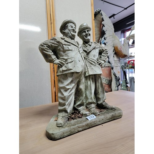 392 - Good quality very heavy garden concrete figure of Laurel and Hardy in good order, shows signs of wea... 