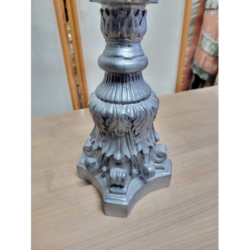 393 - Large resin pillar candle stand complete with glass pot and pillar candle, painted in grey with scro... 