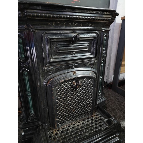 395 - Good quality French antique late Victorian cast iron enamel stove in black with green coloured decor... 