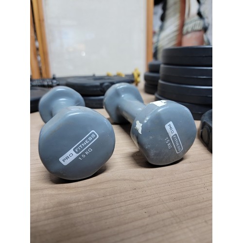 402 - Box containing a quantity of weights inc 6kg kettle weight selection of dumbbell weights from 1.25kg... 