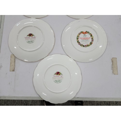 323 - Quantity of Royal Albert bone china Christmas plates with gilt edging covering consecutive years fro... 