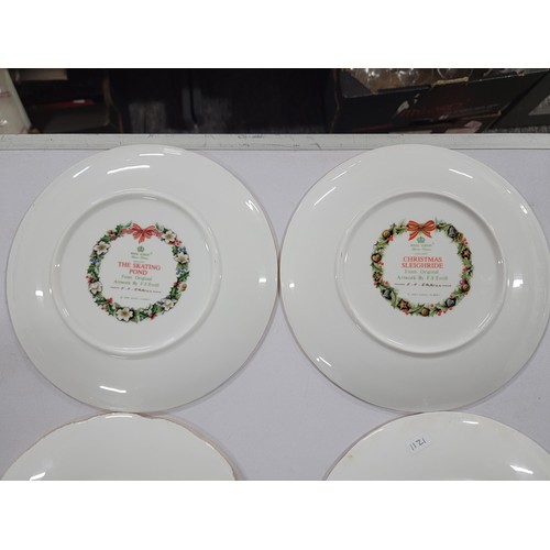 323 - Quantity of Royal Albert bone china Christmas plates with gilt edging covering consecutive years fro... 