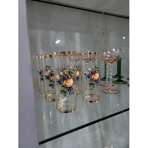 329 - Large quantity of glass ware inc a set of 6x fruit decorated tumblers, 5x twisted stem rose coloured... 