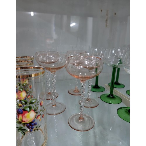 329 - Large quantity of glass ware inc a set of 6x fruit decorated tumblers, 5x twisted stem rose coloured... 