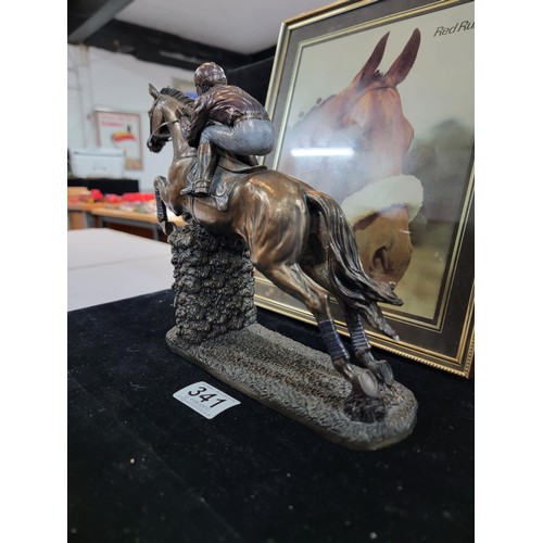 341 - Framed and glazed photo of Red Rum 1970's Grand National Winner along with a resin brass effect hors... 