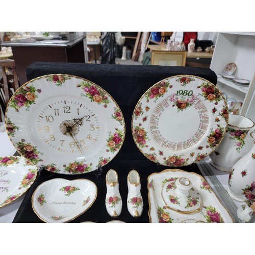 355 - Collection of Royal Albert Old Country Roses inc plates vases jugs, candle stick holders, shoes, clo... 