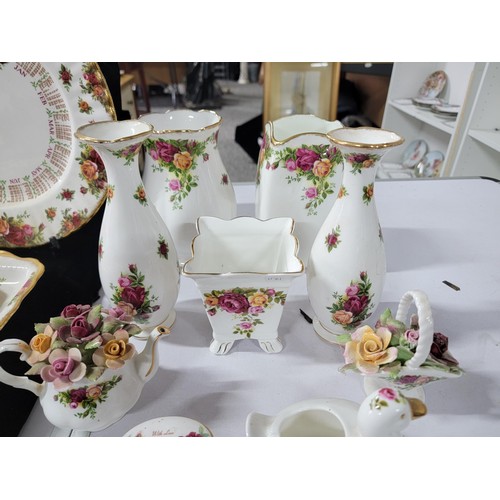 355 - Collection of Royal Albert Old Country Roses inc plates vases jugs, candle stick holders, shoes, clo... 