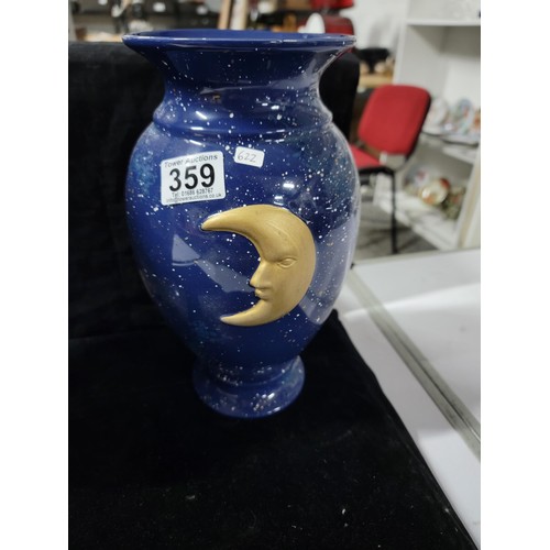 359 - Pair of blue glaze vases both with the a symbol of the moon and the sun respectively , one has nibbl... 