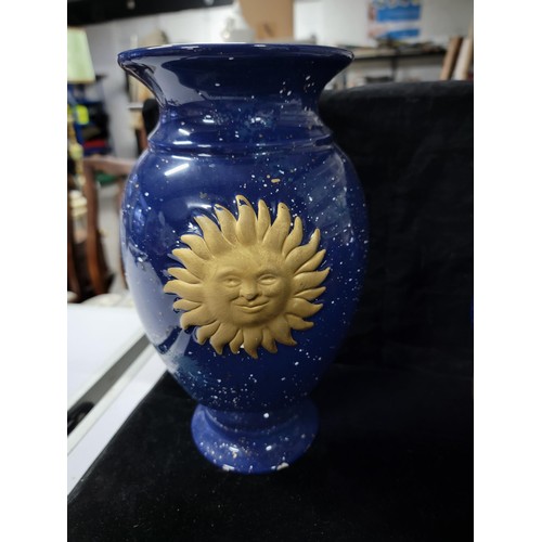 359 - Pair of blue glaze vases both with the a symbol of the moon and the sun respectively , one has nibbl... 