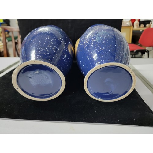 359 - Pair of blue glaze vases both with the a symbol of the moon and the sun respectively , one has nibbl... 