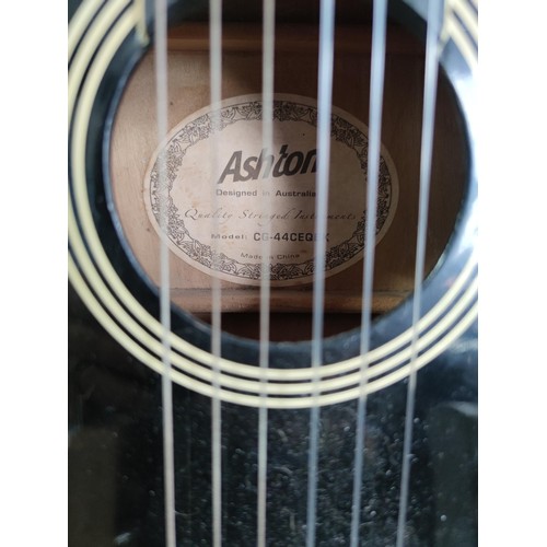 475 - An Ashton electric acoustic nylon strung guitar complete with stand. All in working order, includes ... 