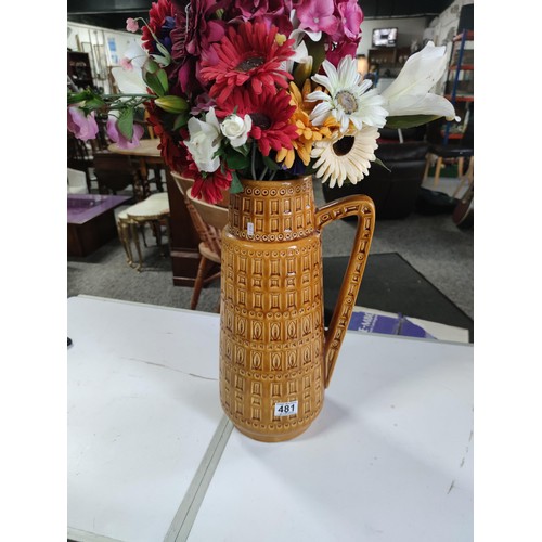 481 - Large West German ceramic jug with plastic flower decoration, in good order stands at 44cm high