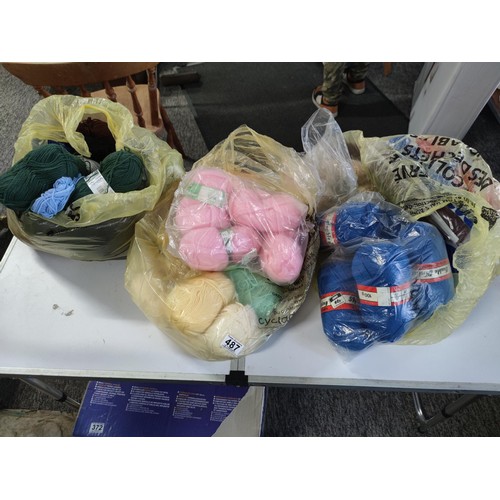 487 - 3x bags conatining a large quantity of knitting wool full, of many colours inc blue, cream, pink,