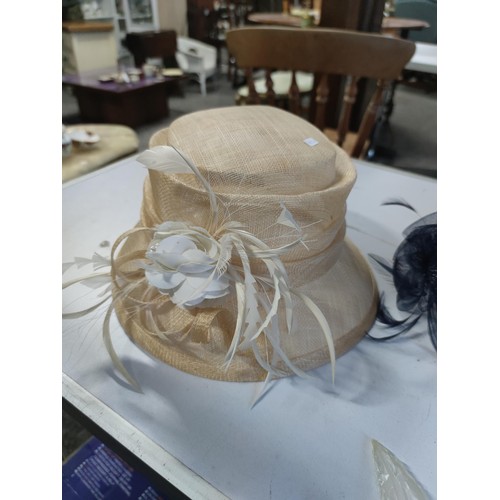 490 - A Dunn & co trilby hat, along with a gents panama hat, also comes with 2x ladies unused wedding hats... 