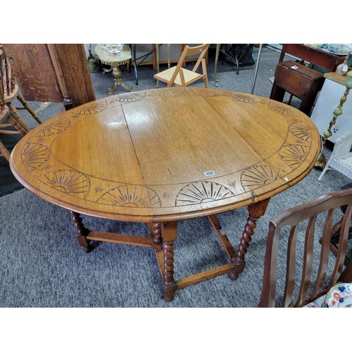 498 - Oak barley twist gate leg table with carvings to top a good sturdy table with very nice patina, meas... 