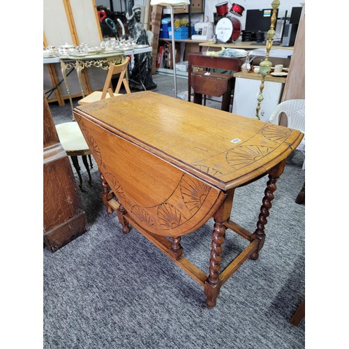 498 - Oak barley twist gate leg table with carvings to top a good sturdy table with very nice patina, meas... 