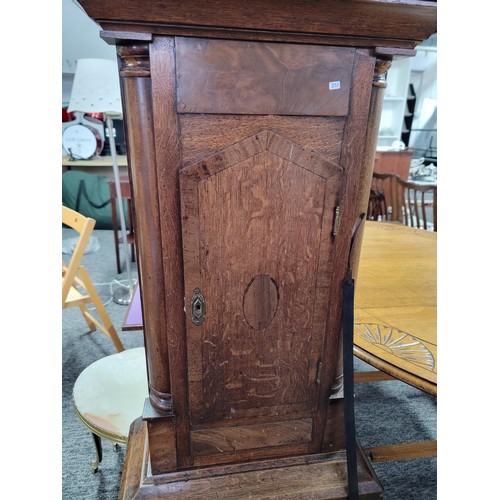 499 - Longcase clock hand painted with great turned pillars with brass caps c19 century with country scene... 