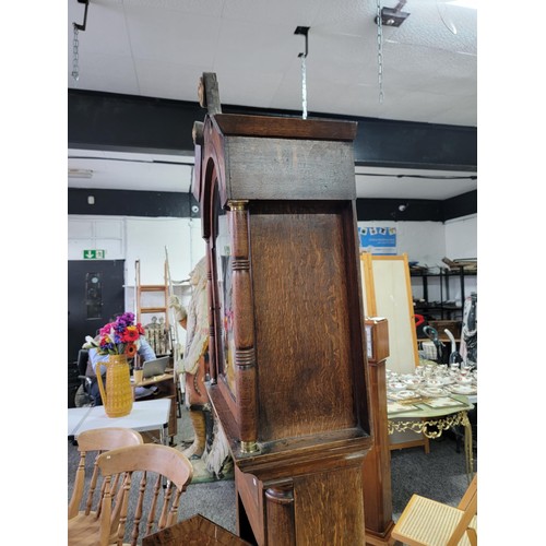 499 - Longcase clock hand painted with great turned pillars with brass caps c19 century with country scene... 