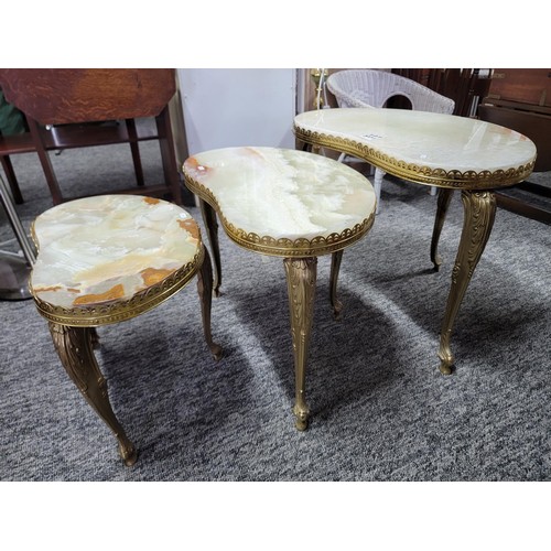 501 - Nest of three Onyx tables with brass frames/legs giving a light green appearance  in good order larg... 