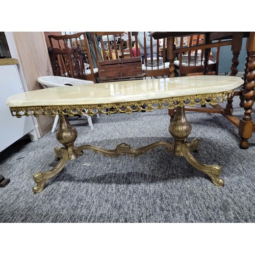 502 - Onyx oval coffee table on brass frame giving super design and in good solid order 
Its 104cm by 45cm