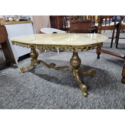 502 - Onyx oval coffee table on brass frame giving super design and in good solid order 
Its 104cm by 45cm