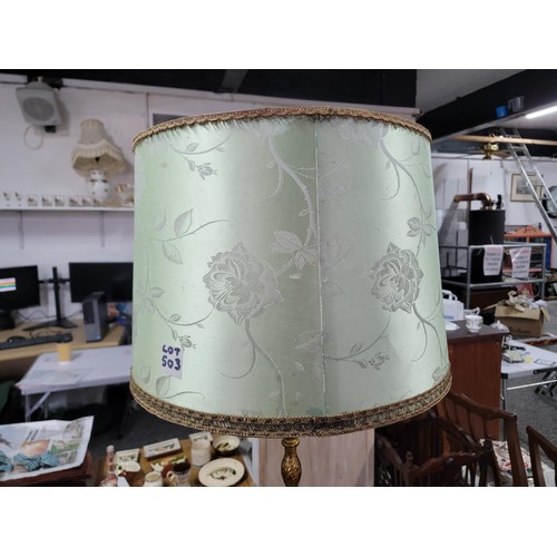 503 - Impressive Onyx featured standard lamp with brass sections with a light green shade