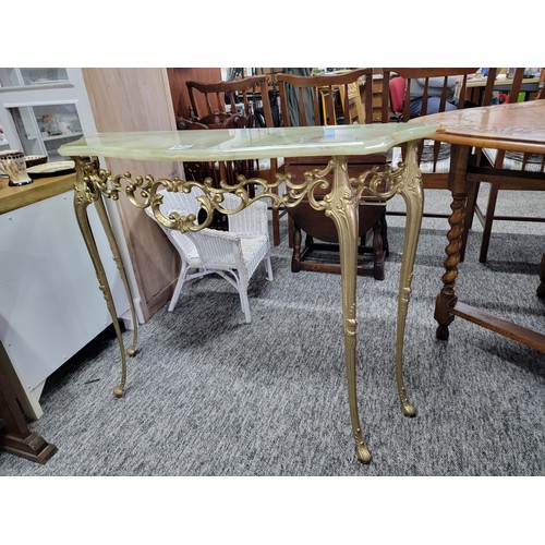 504 - Onyx half moon hall table on light green with brass frame/legs in good order, measuring 74cm high, 9... 