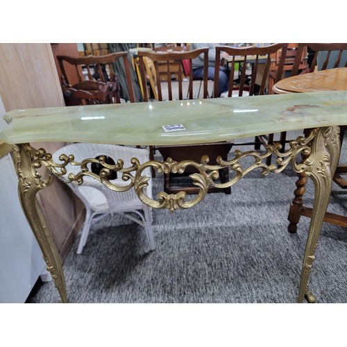 504 - Onyx half moon hall table on light green with brass frame/legs in good order, measuring 74cm high, 9... 