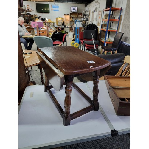 505 - Oak drop sides grog side lamp table along with a writing slope in need of restoration, grog table me... 