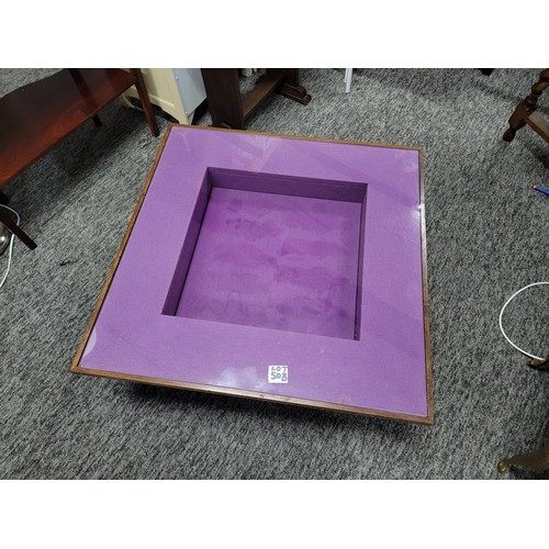 508 - Superb glass topped coffee display table with purple lining to inner with a sunken square hollow gre... 