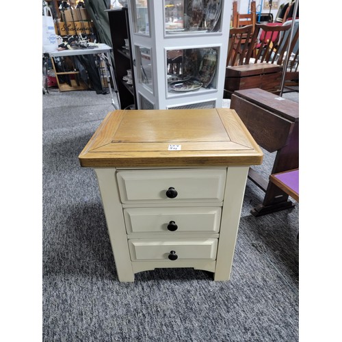 511 - Solid Oak topped bedside chest with three drawers and painted base in good condition stands at 62cm ... 