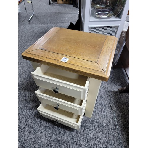 511 - Solid Oak topped bedside chest with three drawers and painted base in good condition stands at 62cm ... 