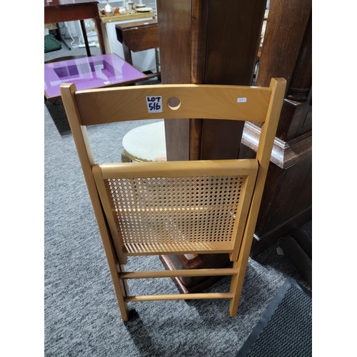 516 - Rattan and wood folding chair ideal for picnics etc measures 79cm high, 38cm wide and 39cm deep