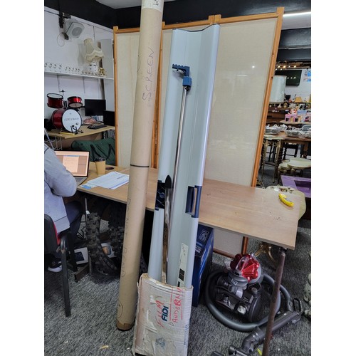 449A - Large roll up movie/projector screen of good quality and hardly used along with a further screen in ... 