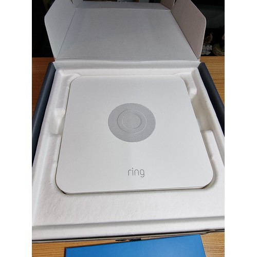 128 - An as new boxed ring alarm base station 5 piece starter kit, first generation. To include base stati... 