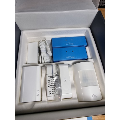 128 - An as new boxed ring alarm base station 5 piece starter kit, first generation. To include base stati... 