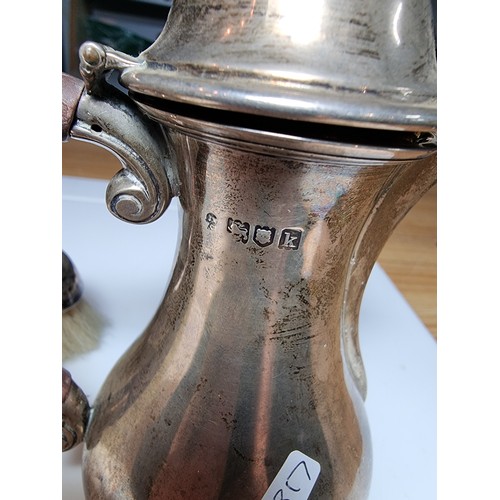 264 - Hallmarked silver lidded small coffee pot along with an hallmarked silver grooming brush. Jug hallma... 