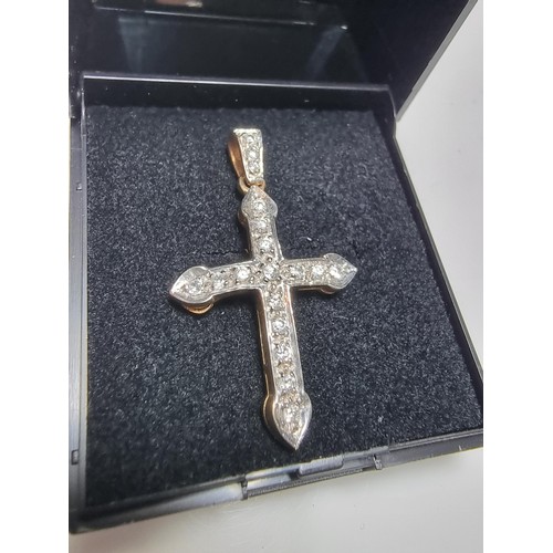 275 - Pretty hallmarked 9ct. yellow gold cross pendant inset with a qty of sparkly CZ stones. In clean con... 