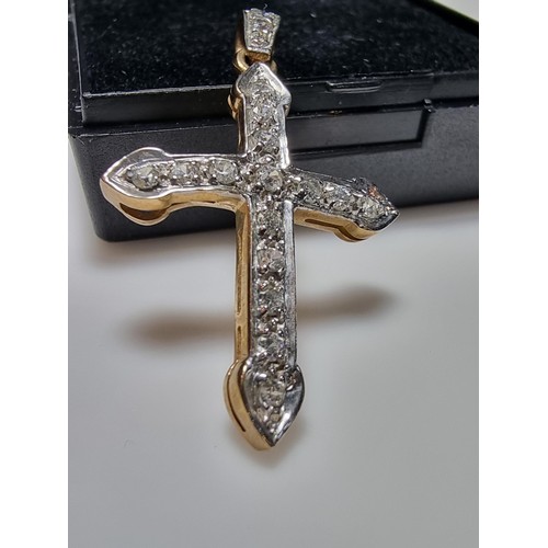 275 - Pretty hallmarked 9ct. yellow gold cross pendant inset with a qty of sparkly CZ stones. In clean con... 