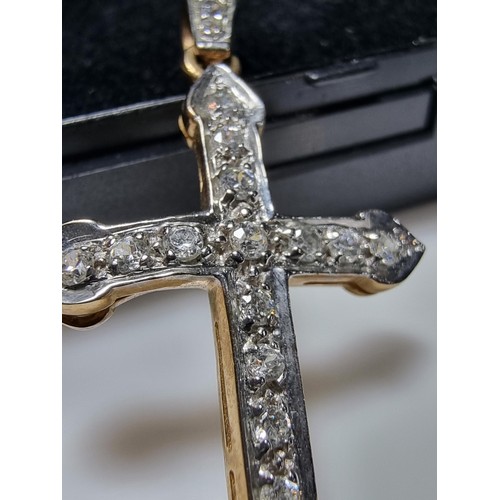 275 - Pretty hallmarked 9ct. yellow gold cross pendant inset with a qty of sparkly CZ stones. In clean con... 