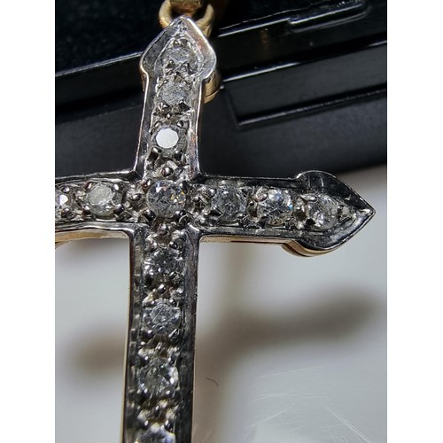 275 - Pretty hallmarked 9ct. yellow gold cross pendant inset with a qty of sparkly CZ stones. In clean con... 