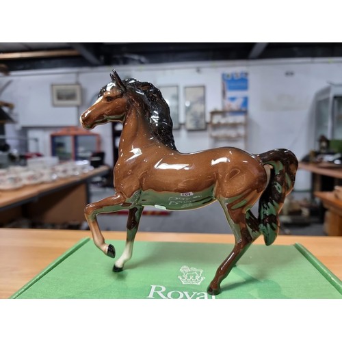 284 - Royal Doulton glazed porcelain horse figure complete with its original box. In excellent clean condi... 