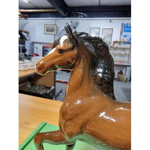 284 - Royal Doulton glazed porcelain horse figure complete with its original box. In excellent clean condi... 