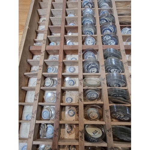 287 - Watchmakers job lot of wristwatch glass crystals in an organised tray containing hundreds of various... 