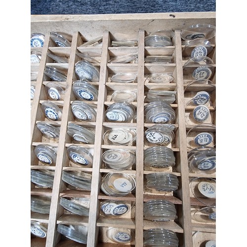 287 - Watchmakers job lot of wristwatch glass crystals in an organised tray containing hundreds of various... 