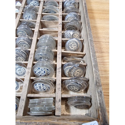 287 - Watchmakers job lot of wristwatch glass crystals in an organised tray containing hundreds of various... 