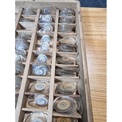 287 - Watchmakers job lot of wristwatch glass crystals in an organised tray containing hundreds of various... 